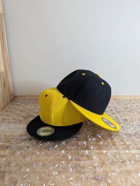 Yellow and black baseball cap.